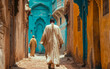 A lone Moroccan man wearing traditional Moroccan clothing walks down an alley in Casablanca