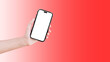 Close-up of hand holding smartphone with blank on screen isolated on background of red.