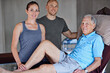© peopleimages.com - Happy people, portrait and physiotherapist with patient in elderly care for muscle or joint pain at clinic. Chiropractor or team with smile by senior man for checkup, health and wellness at hospital