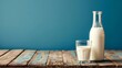 World Milk Day, a bottle of milk and a glass of milk on a wooden table.
