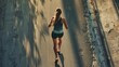 World Running Day, a female runner with a good figure is running. Rear view, high angle, clear picture