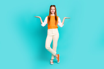 Canvas Print - Full length photo of charming nice girl wear trendy clothes demonstrates empty space two products isolated on aquamarine color background