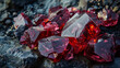 Close-up of sparkling red crystals on a rough stone surface, showcasing their vibrant hues and geometric shapes