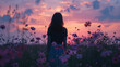 A woman standing in a field of wildflowers at sunset the back button focus capturing the soft pinks and purples of the sky