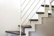 internal home staircase with metal structure, porphyry steps and white metal railing