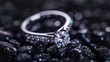 Exquisite silver wedding ring with diamonds close up shoot on black stone abstract background, professional studio photo