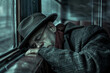 © mila103 - A man in a hat and glasses is sleeping on a train