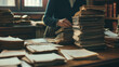 A court clerk diligently sorting through case files on a large oak desk, each document a pivotal piece of the legal puzzle, the room awash in natural light that casts soft shadows around the stacks of