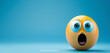 A close-up of a surprised emoji with wide eyes and open mouth on a blue background, with