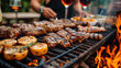 Sizzling barbecue feast on grill with steaks over open flames.