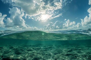 The sun breaks through the clouds, casting a golden light over the vast expanse of the ocean, A hydrosphere viewed from the ocean floor, looking up towards the water surface and the sky, AI Generated