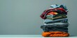 Organized Stack of Clothing Items Ready for Recycling or Donation to Support Sustainability and Charity. Concept Sustainable Fashion, Clothing Recycling, Donation Drive, Charity Support