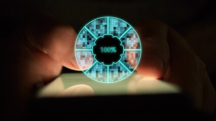 Cg digital pie chart of turquoise color showing one hundred percent load by sector is divided into squares creating a flickering effect against the background of hands using a smartphone in the dark