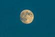 Full moon on the blue sky.