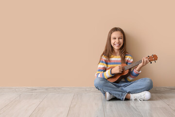 Sticker - Teenage girl playing ukulele on beige background