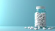 White pills inside a transparent plastic medicine bottle and some scattered around the bottle on a blue background with copy space.