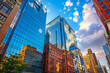 A vibrant midday scene contrasting historic city architecture with sleek new buildings. /