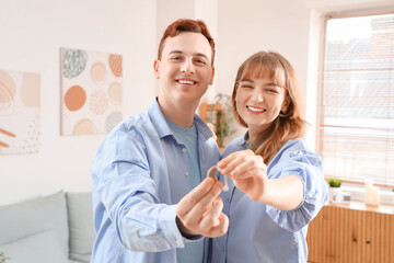 Canvas Print - Young couple with hearing aid at home