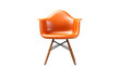 An orange plastic chair with wooden legs in a vibrant setting