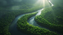 A Breathtaking Aerial View Of A River Winding Through A Dense, Tropical Rainforest, With Rays Of Sunlight Breaking Through The Canopy.