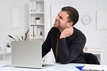 Poster - Businessman suffering from neck pain at table in office