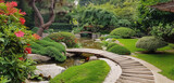 Fototapeta Przestrzenne - A tranquil Japanese tea garden with a winding stone path, a wooden bridge, and a serene koi pond.