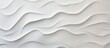 A close up of a grey slope landscape with aeolian landform patterns resembling waves on a white wall, creating a serene and unique aesthetic
