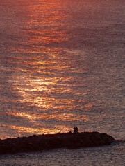 Canvas Print - Coucher du soleil pêcheurs digue