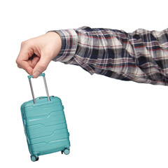 Wall Mural - luggage and hand luggage, a miniature mint-colored suitcase on a white isolated background in the hand, the concept of a limit on the weight of baggage carried in airlines