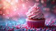 Cupcake with pink frosting and colorful sprinkles on bokeh background