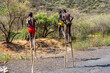 © Angela Meier - Ethiopia, near Key afer, boys from the Banna tribe walking on stilts.