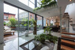 A minimalist urban dwelling with clean lines, floor-to-ceiling windows, and a rooftop garden.