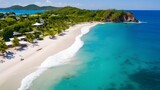 Fototapeta Londyn - Aerial view of beautiful tropical beach with white sand, turquoise ocean water and blue sky.
