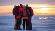 Four adventurers huddle together for warmth on a frozen tundra backs to the camera. Despite the challenging conditions . .
