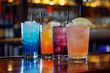 © Tida - Row of colorful cocktail drinks on bar - Vibrant, refreshing alcoholic beverages lined on a dark bar with colorful backdrop, inviting a taste of nightlife