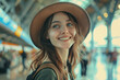 © Marina Shvedak - happy young woman traveller in airport, female tourist waiting for a journey