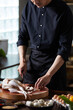 © Blue Jean Images - Cook making dishes in the kitchen