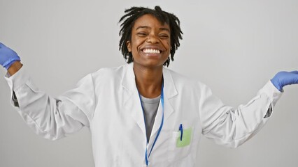 Poster - Excited young black woman with dreadlocks in labcoat celebrates big win; yes! triumph and joy light up her face against an isolated white background