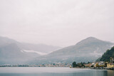 Fototapeta Tęcza - Misty mountains on the coast of Lake Como with luxury villas. Italy