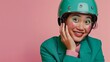 a smiling humble silly indonesian woman wearing emerald green helmet, emerald green jacket and vibrant make up, fingers poke her cheek
