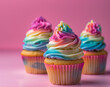 Cupcakes adorned with vibrant, rainbow-like frosting