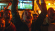 a group of fans at the moment a goal is scored in a bar 