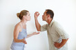 © peopleimages.com - Divorce, couple and fight in studio with anger for conflict, crisis or stress isolated on a white background. Man, woman and argument for breakup, cheating and frustrated at marriage fail together