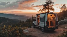 Solitary Camper Van Parked On A Serene Mountain Peak At Twilight.
