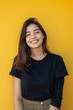 © Nica - a 25 years old girl wearing a black oversized t shirt and a skirt beautiful smile in a natural yellow professional background full body