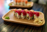 Fototapeta Desenie - Philadelphia sushi rolls close-up on the table in a sushi restaurant