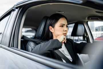 Wall Mural - Driving during rush hour But the traffic is very congested. Angry face. Young asian businesswoman has broken down car on the road she feeling serious and stressed. Car crash Look for someone help.