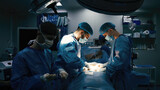 Fototapeta  - Close-up of surgeons in protective clothing in a modern operating room. Healthcare, surgery and cosmetic surgery concept.