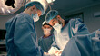 A group of professional surgeons in the operating room. Close-up of a surgical operation. Plastic surgery. Health. Surgery in a private clinic. Beauty and health.