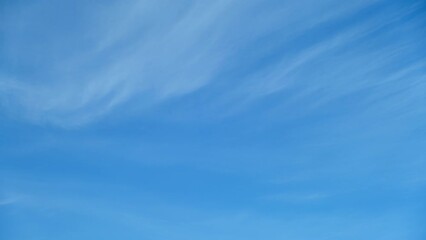 Wall Mural - Blue sky background with tiny clouds
